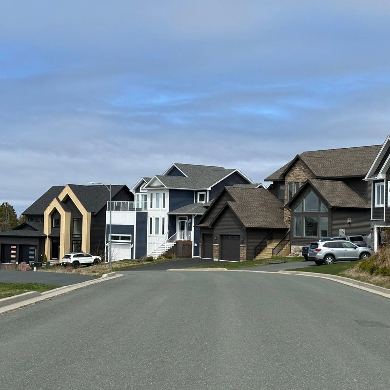 Luxury modern homes on a suburban street.